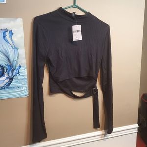 Black mock neck crop top with strap detail